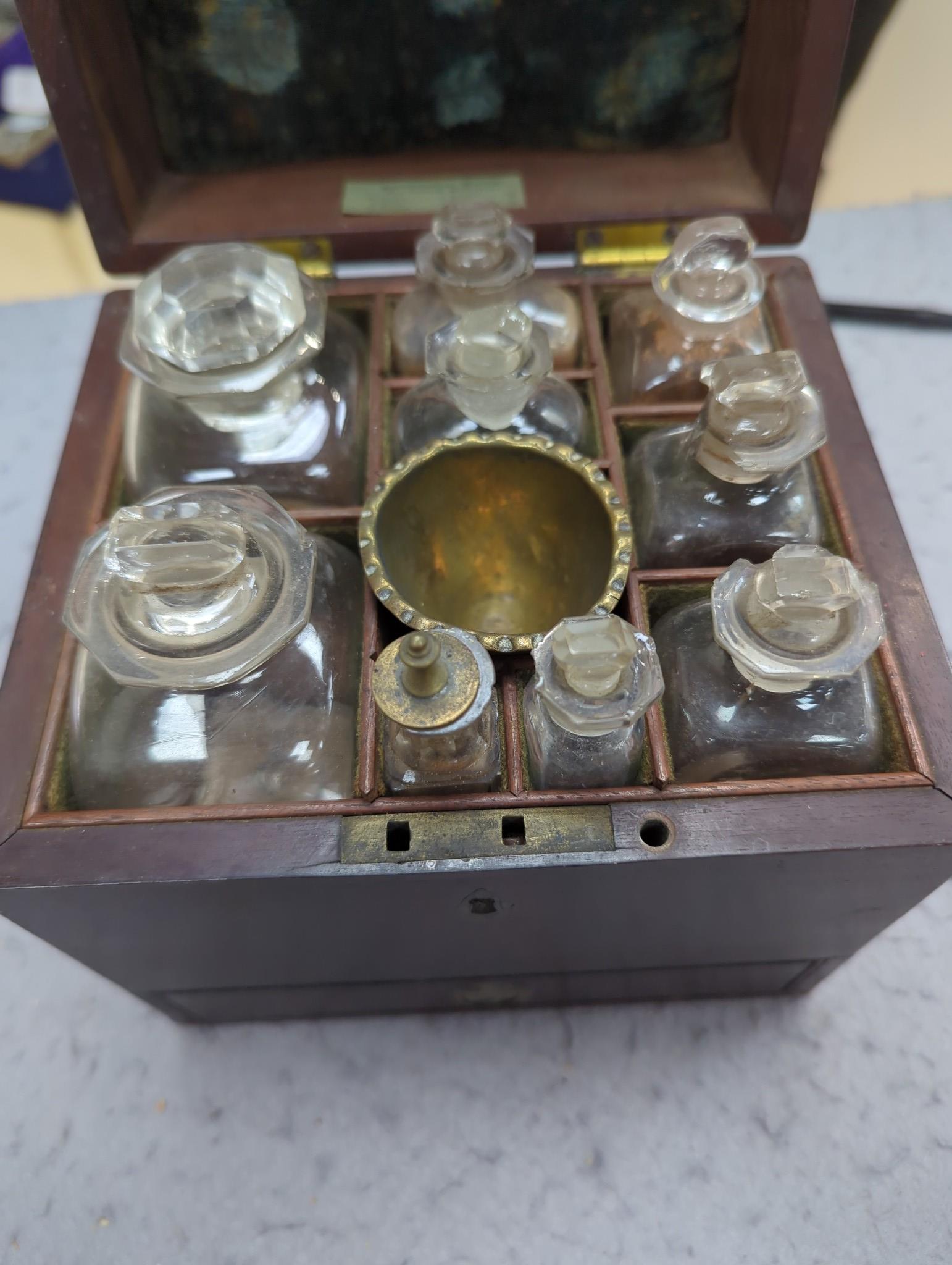A George III mahogany cased travelling apothecary set with glass flasks, 19cm high